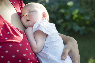 Baby girl in the arms of her mother - DEGF000513