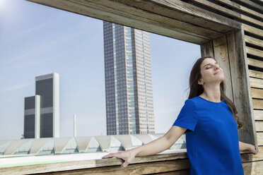 Germany, Frankfurt, businesswoman relaxing with closed eyes - RIBF000292