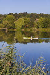 Germany, Stuttgart, woman kayaking on Max-Eyth-See - WDF003243