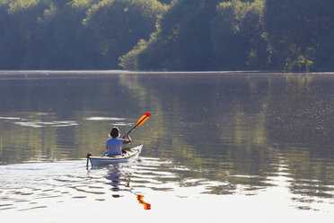 Germany, Stuttgart, woman kayaking on Max-Eyth-See - WDF003245