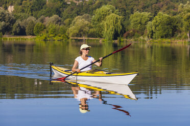 Germany, Stuttgart, woman kayaking on Max-Eyth-See - WDF003247