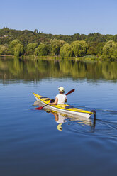 Germany, Stuttgart, woman kayaking on Max-Eyth-See - WDF003248