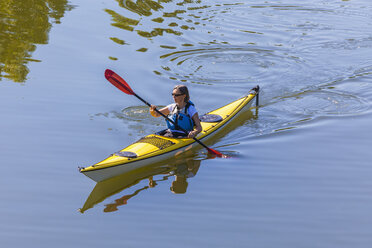 Germany, woman kayaking - WDF003256