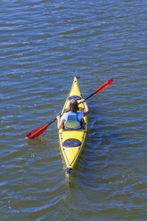 Germany, woman kayaking - WDF003258