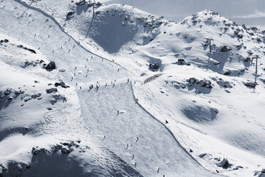 Austria, Tyrol, Ischgl, skiers on slope in winter landscape - ABF000649