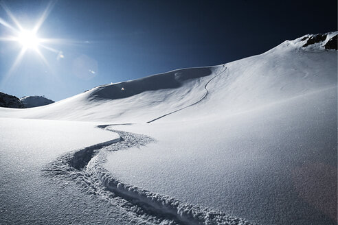 Austria, Tyrol, Ischgl, ski tracks in powder snow - ABF000640