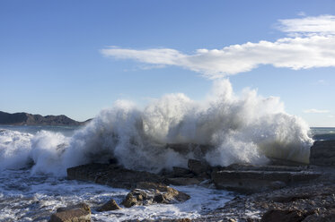 Spain, Ibiza, waves crashing on the rocks - TKF000420