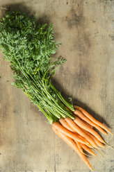 Bunch of carrots on wood - ODF001295