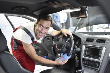 Car cleaning, man cleaning car, vehicle interior - LYF000477