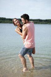 Germany, Haltern, young couple relaxing at Silbersee - GDF000870