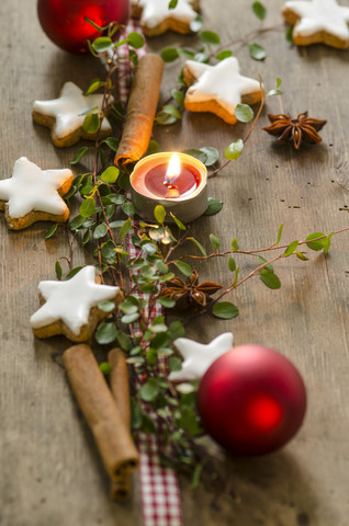 Christmas decoration with tea light and cinnamon stars stock photo