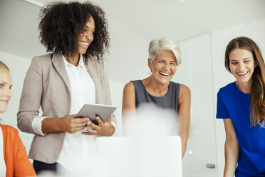 Happy businesswomen having a meeting in conference room - MFF002169