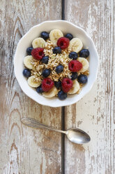 Bowl of muesli with banana slices, raspberries and blueberries - EVGF002226