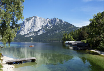 Austria, Styria, Altaussee, boat on lake with Trisselwand at Totes Gebirge - WWF003870