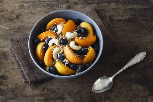 Bowl of muesli with cracked buckwheat, fruits, sesame and cashew nuts - EVGF002242