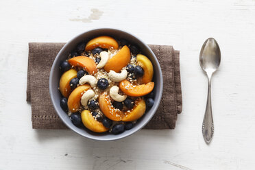 Bowl of muesli with cracked buckwheat, fruits, sesame and cashew nuts - EVGF002243