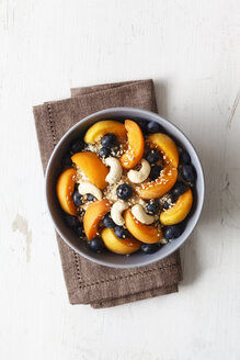 Bowl of muesli with cracked buckwheat, fruits, sesame and cashew nuts - EVGF002244