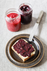Homemade raspberry and blackberry jam with chia seeds, slice of bread - EVGF002437
