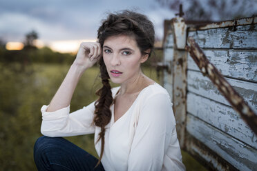 Portrait of woman with braid at twilight - SHKF000369