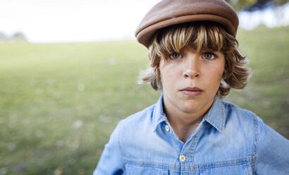 Portrait of serious looking blond boy wearing cap - MGOF000764