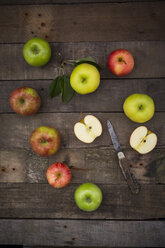 Different apples and pocket knife on wood - LVF003838