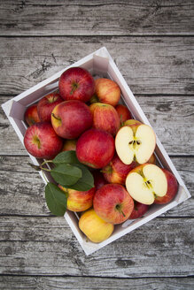 Box of red apples on wood - LVF003862