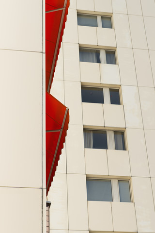 Germany, Duesseldorf, red canvas blind at high-rise residential building stock photo