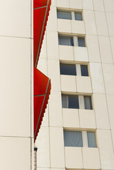 Germany, Duesseldorf, red canvas blind at high-rise residential building - VIF000409