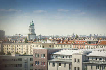 Germany, Berlin, Frankfurter Tor over the roofs of the surrounding buildings - NKF000404