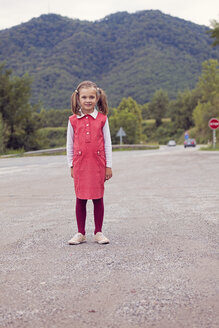 Portrait of little girl with braids wearing red dress - XCF000036