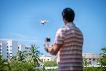 Man flying drone - ABAF001941