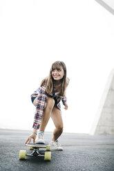 Young woman on longboard - JRFF000092