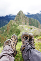 Peru, Machu Picchu region, Travelers looking at Machu Picchu citadel and Huayna mountain - GEMF000411