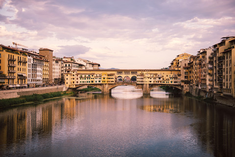 Italy, Florence, River Arno and Ponte Vecchio at sunset stock photo