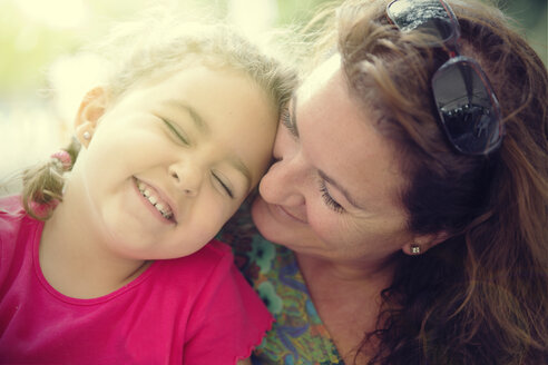 Woman cuddling with her little daughter - ERLF000044