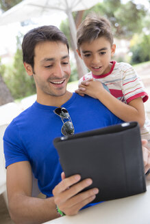 Portrait of father and son with digital tablet - ERLF000048