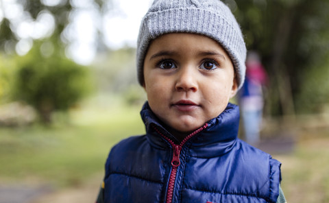 Portrait of little boy wearing woolly hat and waistcoat stock photo