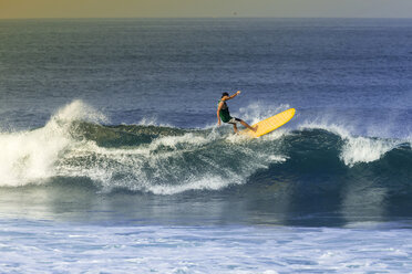 Indonesia, Bali, man surfing a wave - KNTF000102