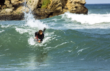 Spain, Asturias, Colunga, body board rider on the waves - MGOF000828