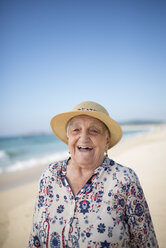 Spain, Ferrol, portrait of laughing senior woman on the beach - RAEF000531