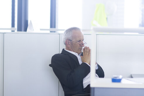 Businessman in open space office thinking - SGF001891