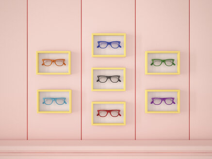 Bunte Gläser in gelben Rahmen hängen an einer rosa Wand - UWF000631