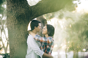 Young couple in love hugging in a park - JRFF000123