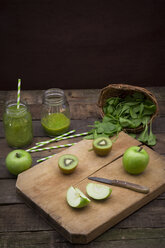 Two glasses of apple kiwi spinach smoothie and ingredients - LVF003970