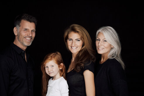 Portrait of three generations family in front of black background - CHAF001539