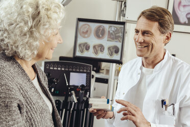 Senior patient getting prescription medication from doctor - MFF002281