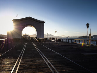 USA, San Francisco, train ferry slip at Pier 43 on Fisherman's Wharf at sunset - SBDF002325