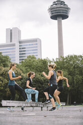 Four women having an outdoor workout - MADF000525