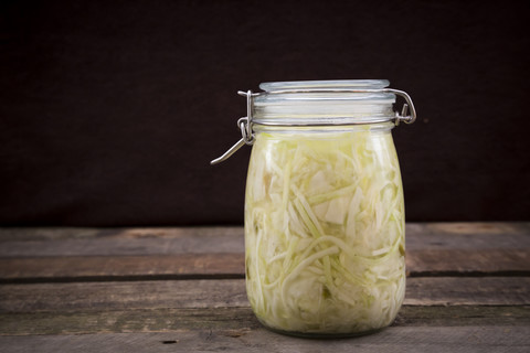 Homemade sauerkraut in preserving jar stock photo