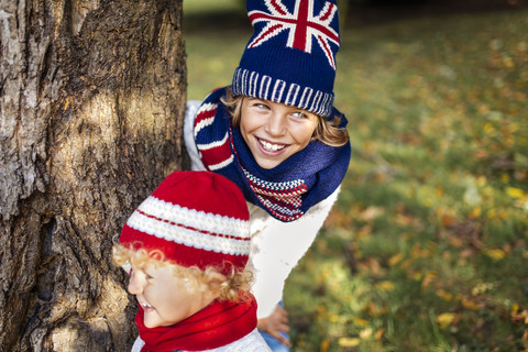 Portrait of two blond boys wearing fashionable knit wear in autumn stock photo